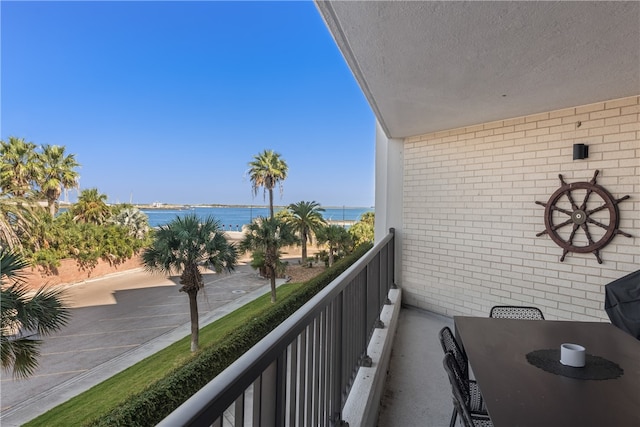 balcony featuring a water view