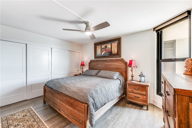 bedroom with hardwood / wood-style floors and ceiling fan