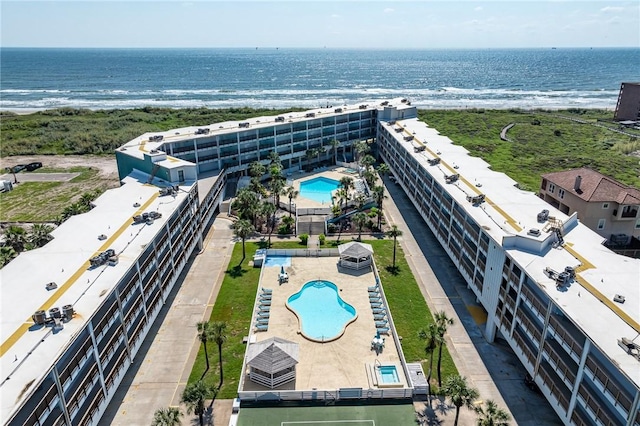aerial view of a pool and a large body of water