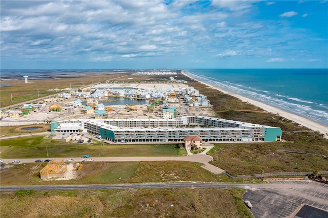 bird's eye view with a water view and a view of the beach