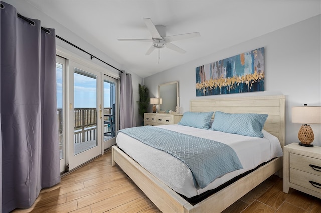 bedroom with access to exterior, ceiling fan, and wood finished floors