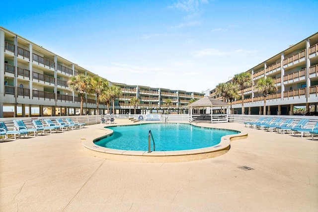 view of swimming pool featuring a patio