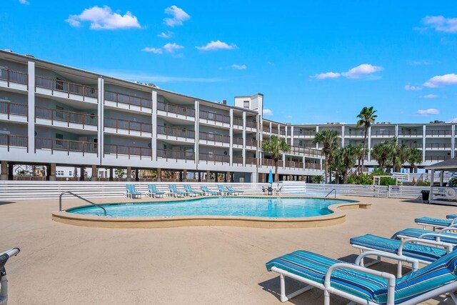 view of swimming pool with a patio area