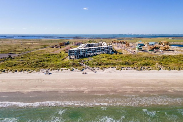 bird's eye view with a water view and a beach view