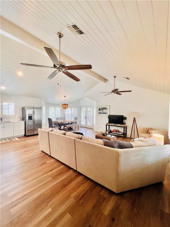 living room featuring hardwood / wood-style flooring, ceiling fan, wood ceiling, and vaulted ceiling