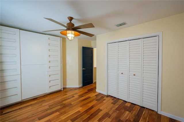 unfurnished bedroom with hardwood / wood-style flooring and ceiling fan