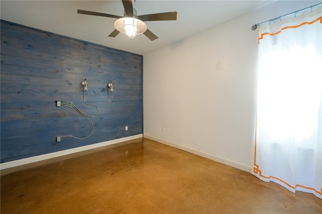 unfurnished room with ceiling fan