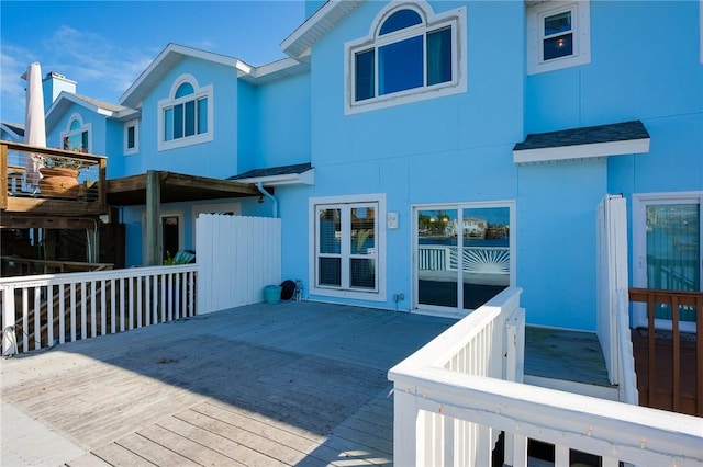 back of house with a wooden deck