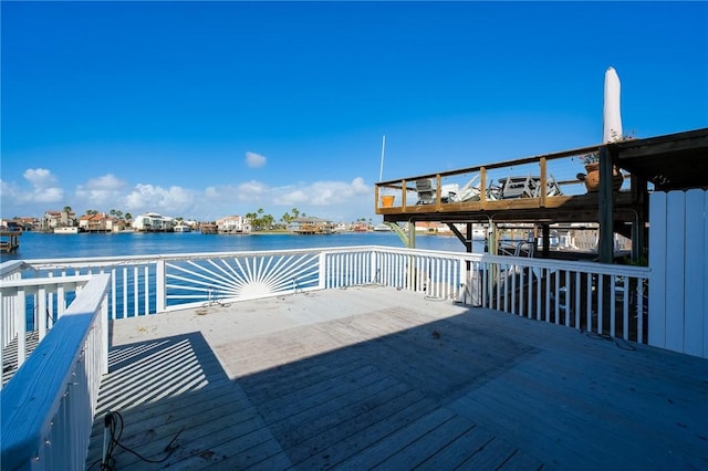 view of dock featuring a deck with water view