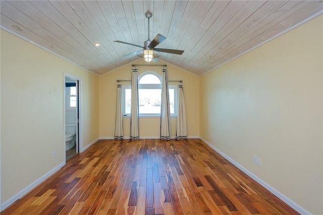 spare room featuring hardwood / wood-style floors, ceiling fan, wooden ceiling, and a wealth of natural light