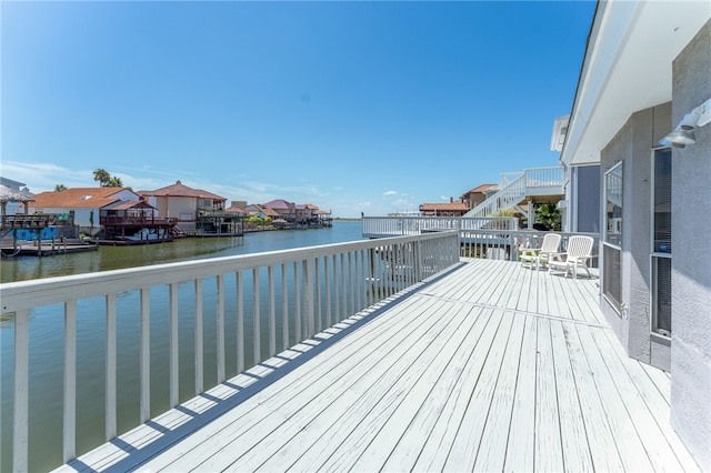 deck featuring a water view