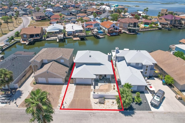 birds eye view of property with a water view