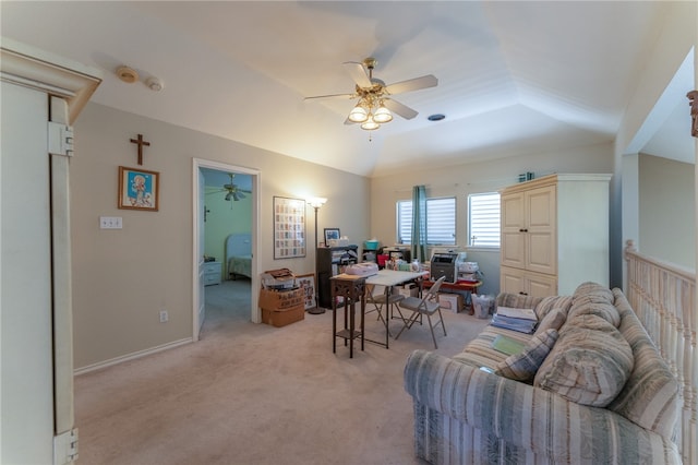 carpeted office featuring lofted ceiling and ceiling fan