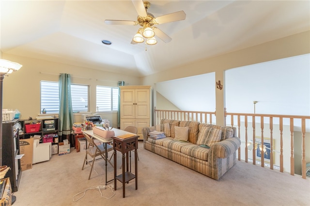 living room with light colored carpet, a tray ceiling, ceiling fan, and vaulted ceiling