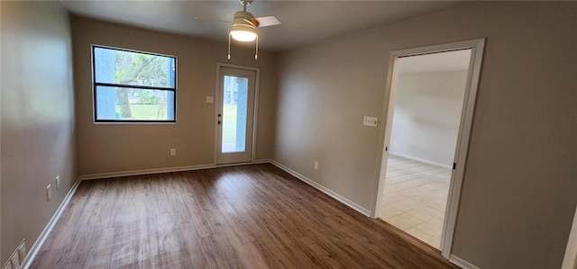 interior space with hardwood / wood-style floors, ceiling fan, and a wealth of natural light