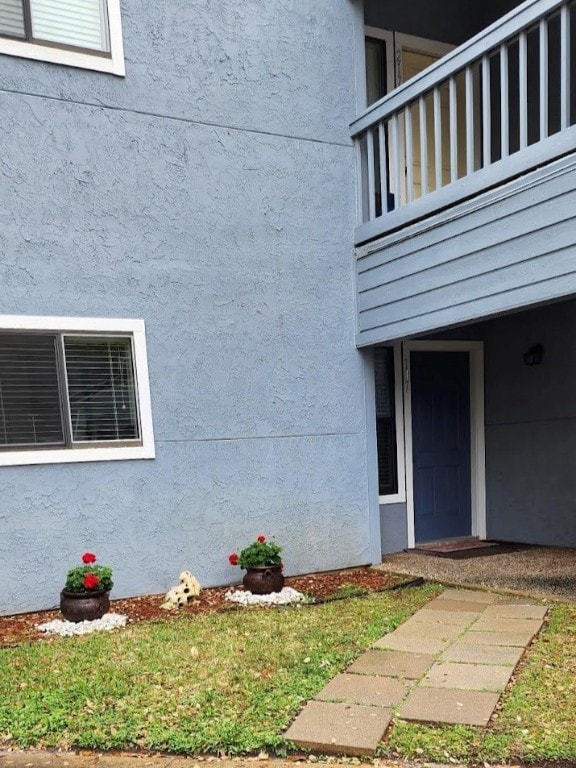 doorway to property featuring a balcony