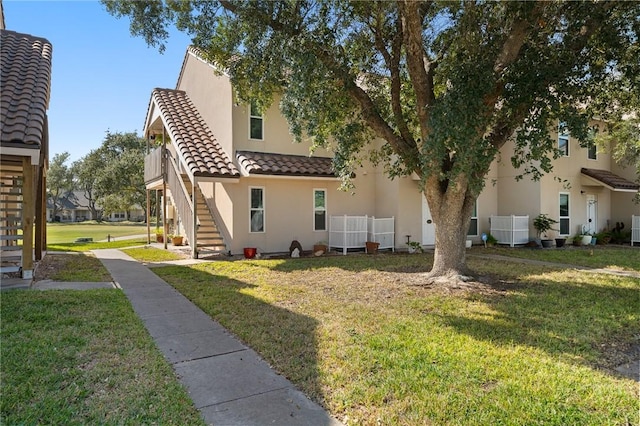 exterior space with cooling unit and a lawn