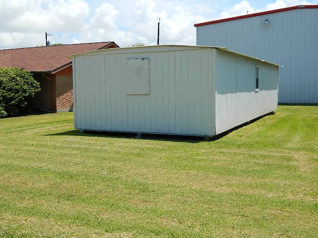 view of outbuilding with a lawn