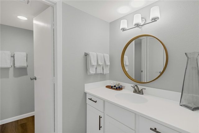 bathroom with wood-type flooring and vanity