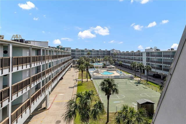 view of pool featuring basketball court