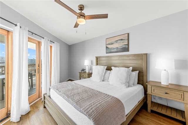 bedroom with light wood-type flooring, access to outside, and ceiling fan