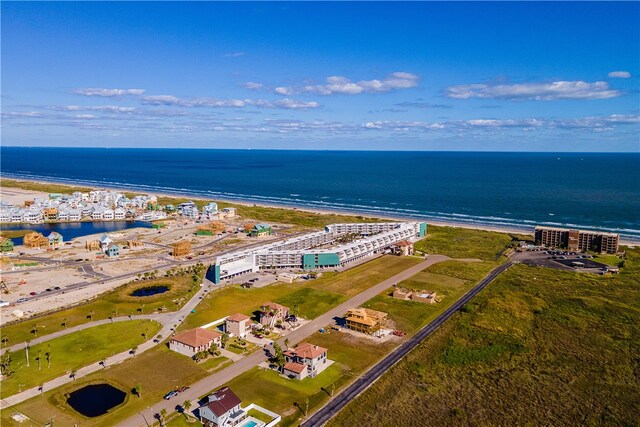 drone / aerial view with a water view and a view of the beach