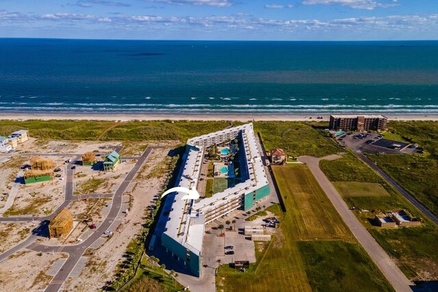 drone / aerial view featuring a view of the beach and a water view