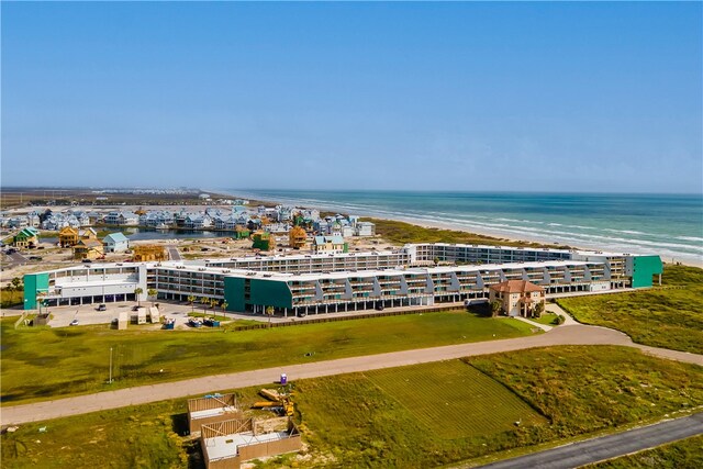 drone / aerial view featuring a beach view and a water view