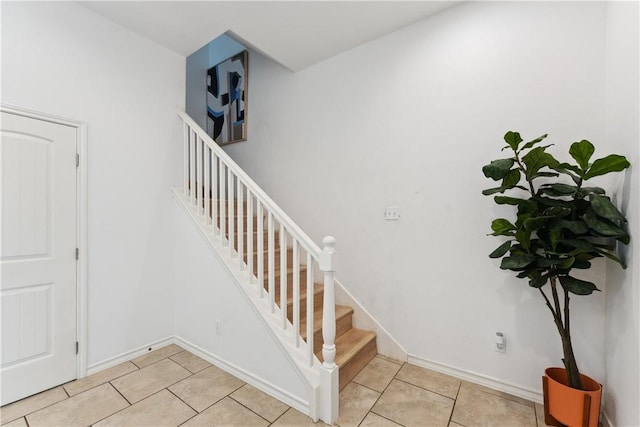 14334 Cruiser St Unit 101, Corpus Christi, TX 78418 - stairs with tile patterned flooring and baseboards