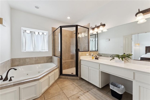 14334 Cruiser St Unit 101, Corpus Christi, TX 78418 - full bath featuring a stall shower, a tub with jets, double vanity, and tile patterned floors