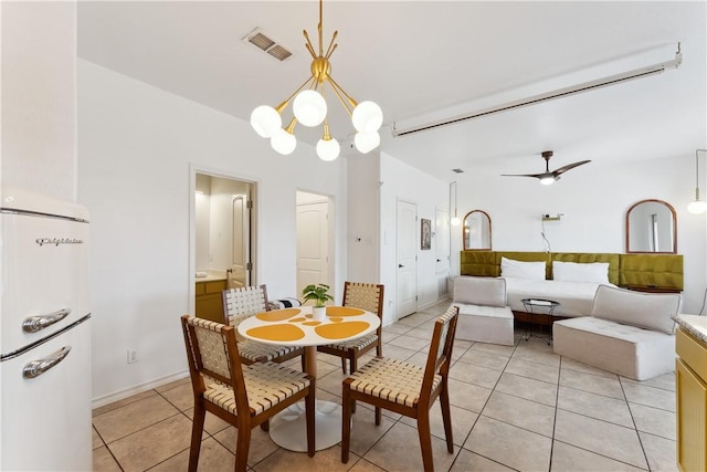 14334 Cruiser St Unit 101, Corpus Christi, TX 78418 - dining area featuring light tile patterned floors, a chandelier, and a ceiling fan