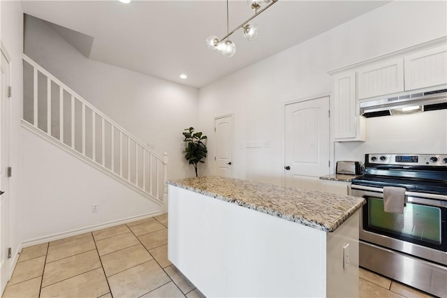 14334 Cruiser St Unit 101, Corpus Christi, TX 78418 - kitchen featuring stainless steel electric range oven, under cabinet range hood, a kitchen island, white cabinetry, and light tile patterned floors