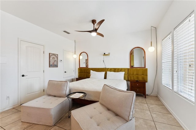 14334 Cruiser St Unit 101, Corpus Christi, TX 78418 - bedroom featuring light tile patterned floors, multiple windows, and ceiling fan