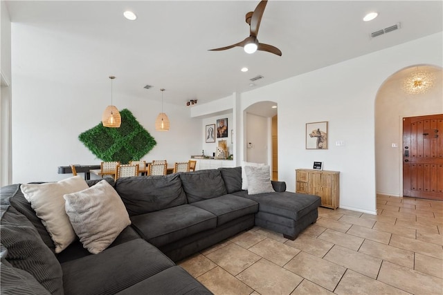 14334 Cruiser St Unit 101, Corpus Christi, TX 78418 - living room featuring arched walkways, ceiling fan, recessed lighting, and light tile patterned floors