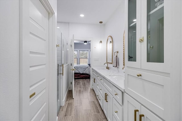 bathroom featuring ceiling fan and vanity