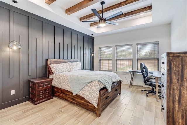 bedroom featuring ceiling fan and beam ceiling