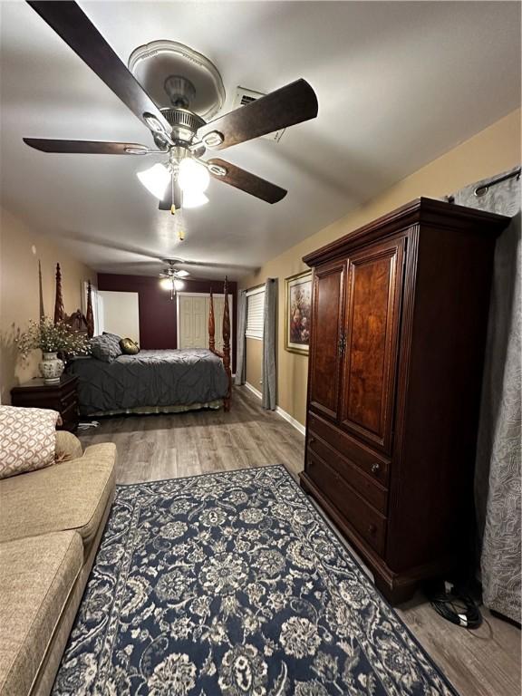 bedroom featuring ceiling fan and light wood-style flooring