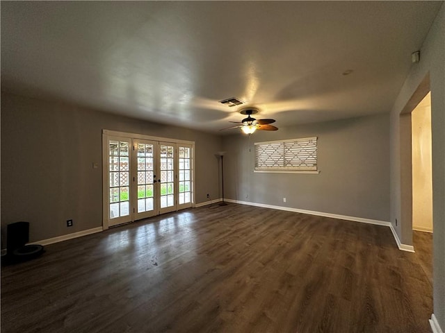 3321 Casa Bonita Dr, Corpus Christi, TX 78411 - unfurnished room with french doors, a ceiling fan, baseboards, visible vents, and dark wood-style floors