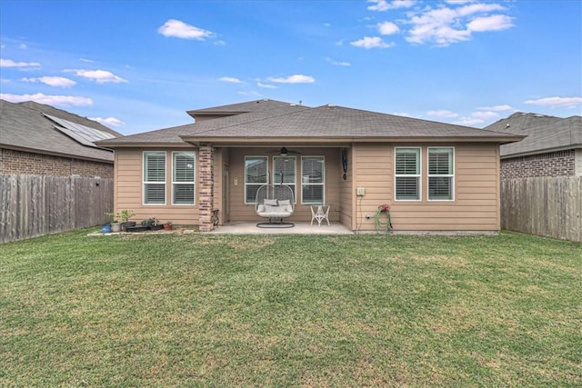 back of house with a yard, ceiling fan, and a patio area