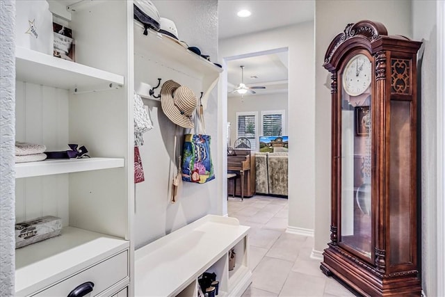 mudroom with light tile patterned floors and ceiling fan