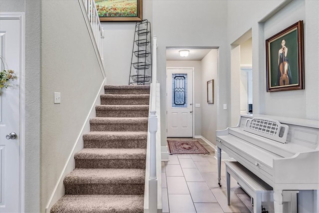 entrance foyer featuring light tile patterned floors