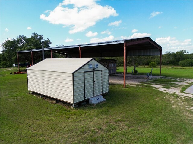 view of outbuilding with a yard