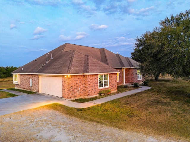 view of property exterior featuring a garage and a yard