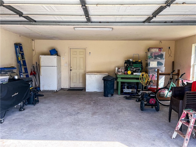 garage featuring white fridge