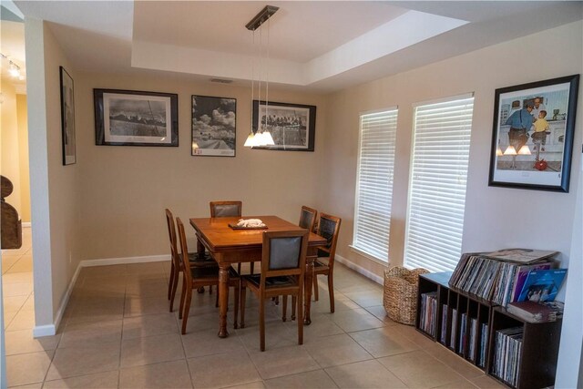 2562 Big Oak Ln, Ingleside, TX 78362 - dining area with a raised ceiling, baseboards, and light tile patterned flooring