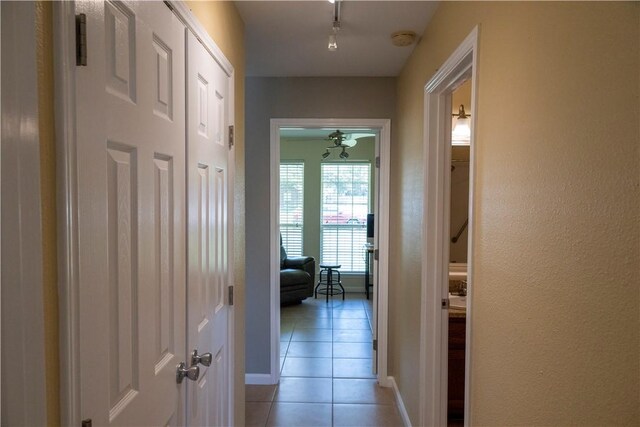 2562 Big Oak Ln, Ingleside, TX 78362 - hall featuring light tile patterned floors, baseboards, and track lighting