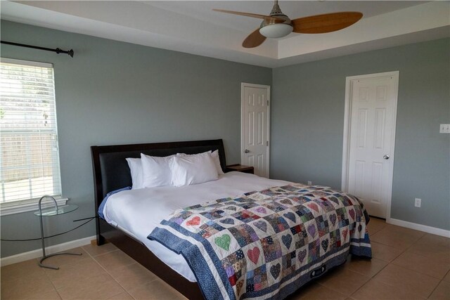 2562 Big Oak Ln, Ingleside, TX 78362 - bedroom with light tile patterned floors, multiple windows, baseboards, and ceiling fan