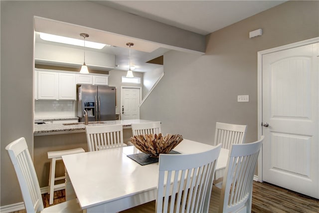 dining space featuring dark hardwood / wood-style flooring