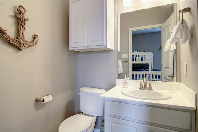 bathroom featuring vanity and toilet