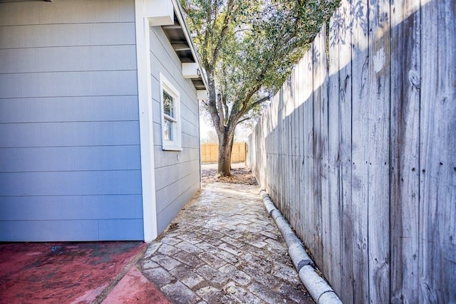 view of side of property with a patio